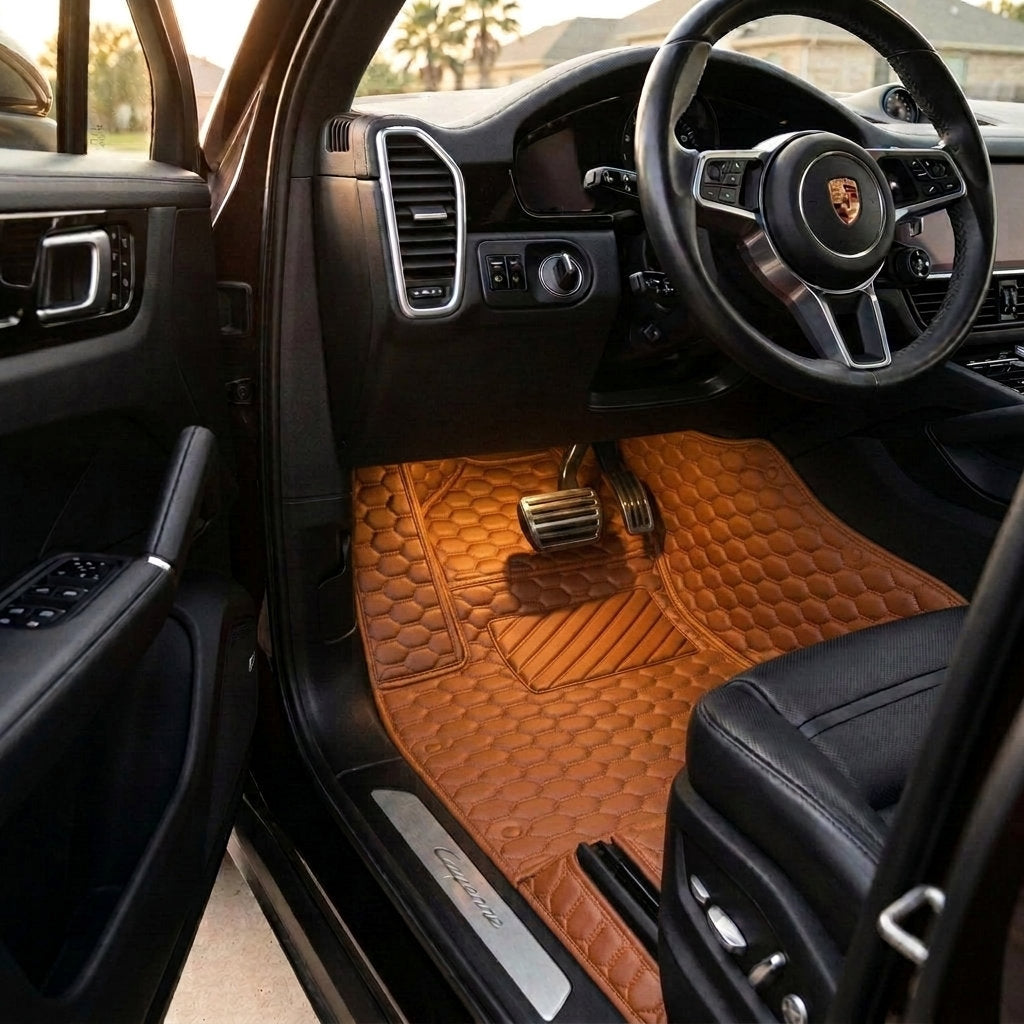 Matrikar Hexa Series custom fit car mats in Caramel Brown fitted in a Porsche Cayenne driver footwell