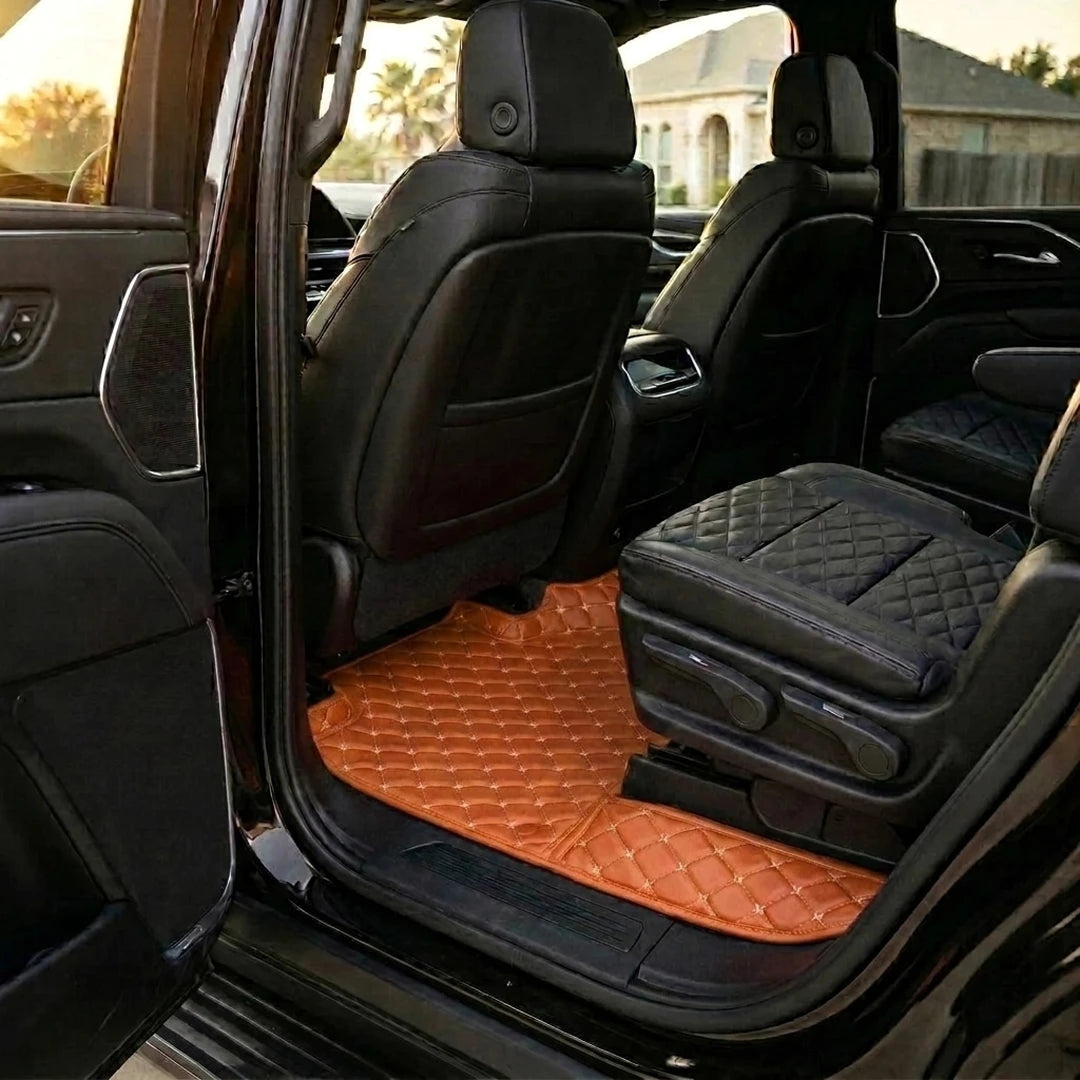 Matrikar Diamond Series custom fit car mats in Caramel Brown fitted in the rear row of a Cadillac Escalade