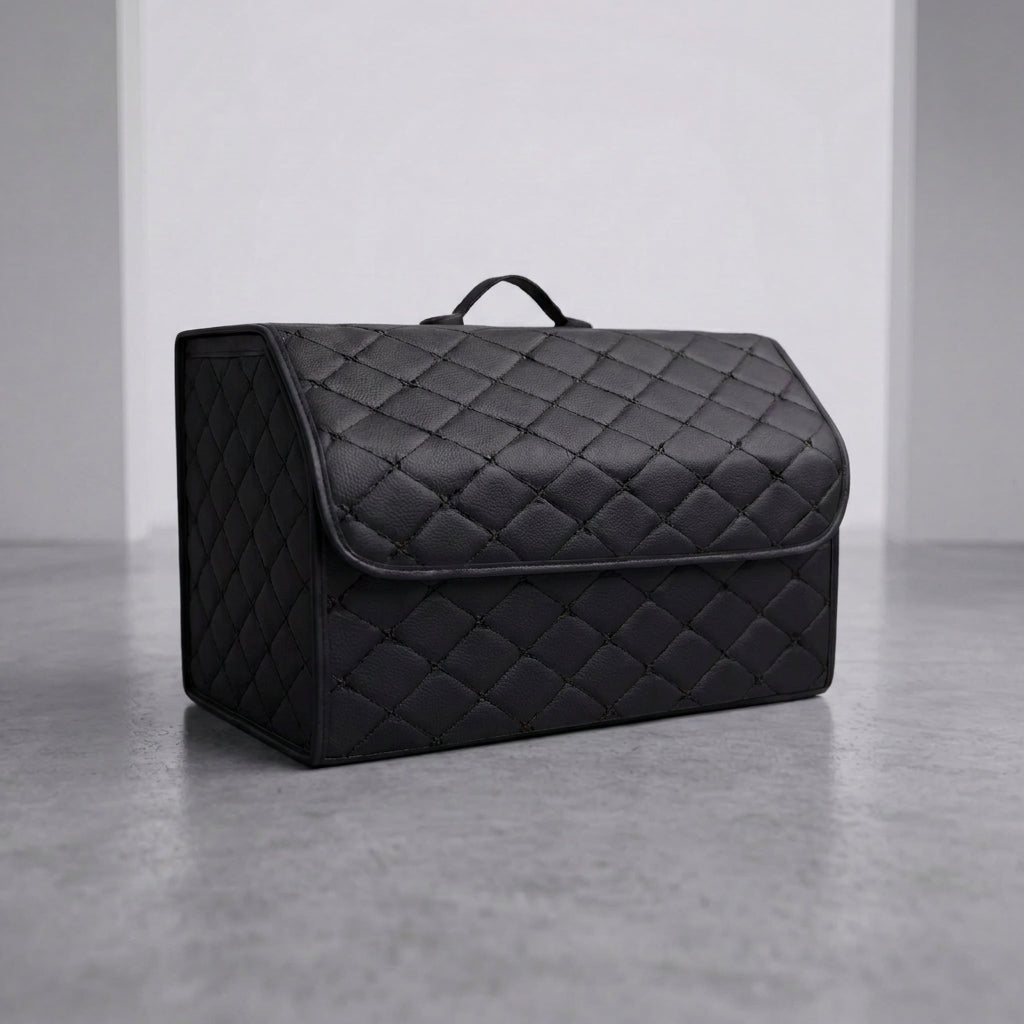 A single Matrikar trunk organizer in All Black, large size, on a studio floor