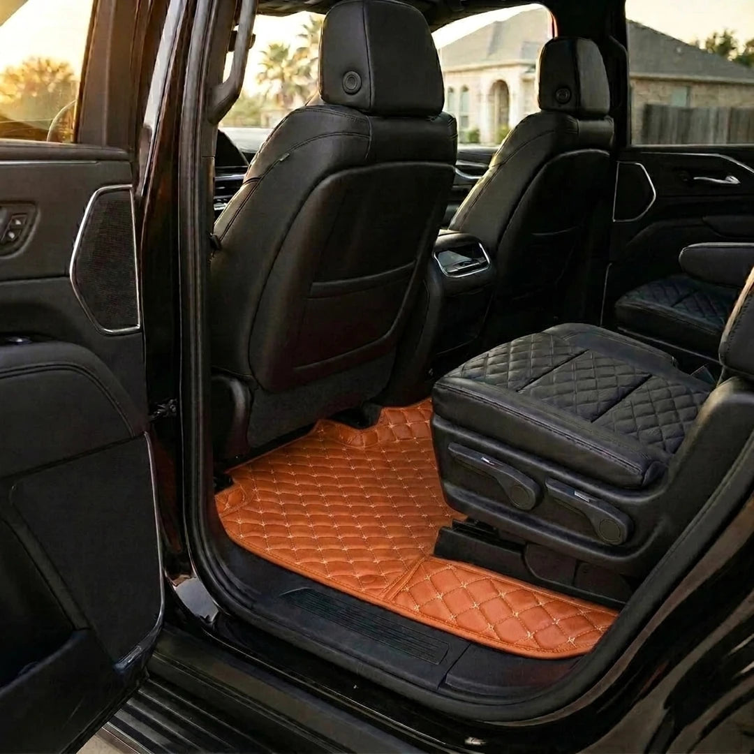 Matrikar Diamond Series custom fit car mats in Caramel Brown fitted in the rear row of a Cadillac Escalade