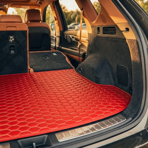 Matrikar Hexa Series custom fit trunk mat in Ferrari Red covering the cargo floor of an SUV
