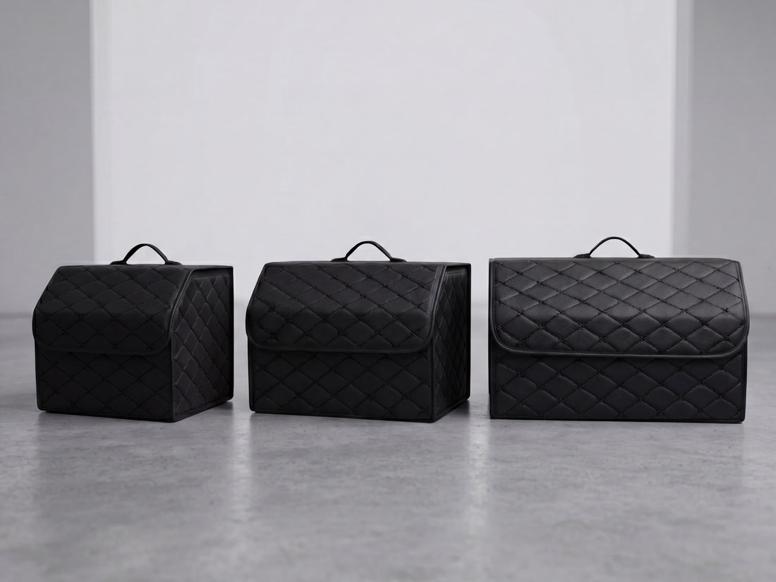 The three sizes of the automotive grade leather trunk organizer in All Black