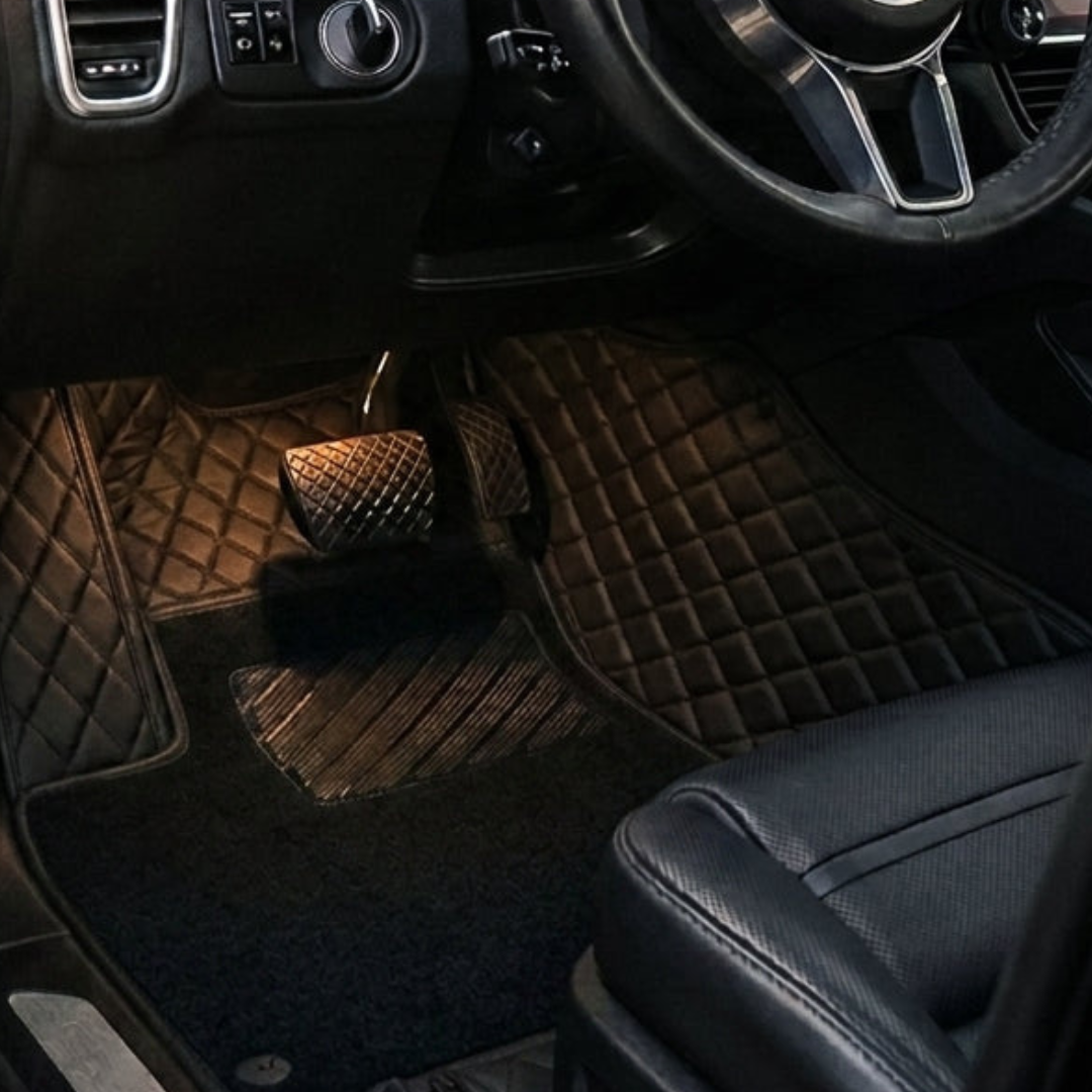 Matrikar Dual-Layer Series custom fit car mat in All Black with a black top carpet, installed in a driver footwell