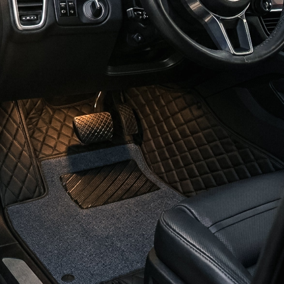 Matrikar Dual-Layer Series custom fit car mat in All Black with a grey top carpet, installed in a driver footwell