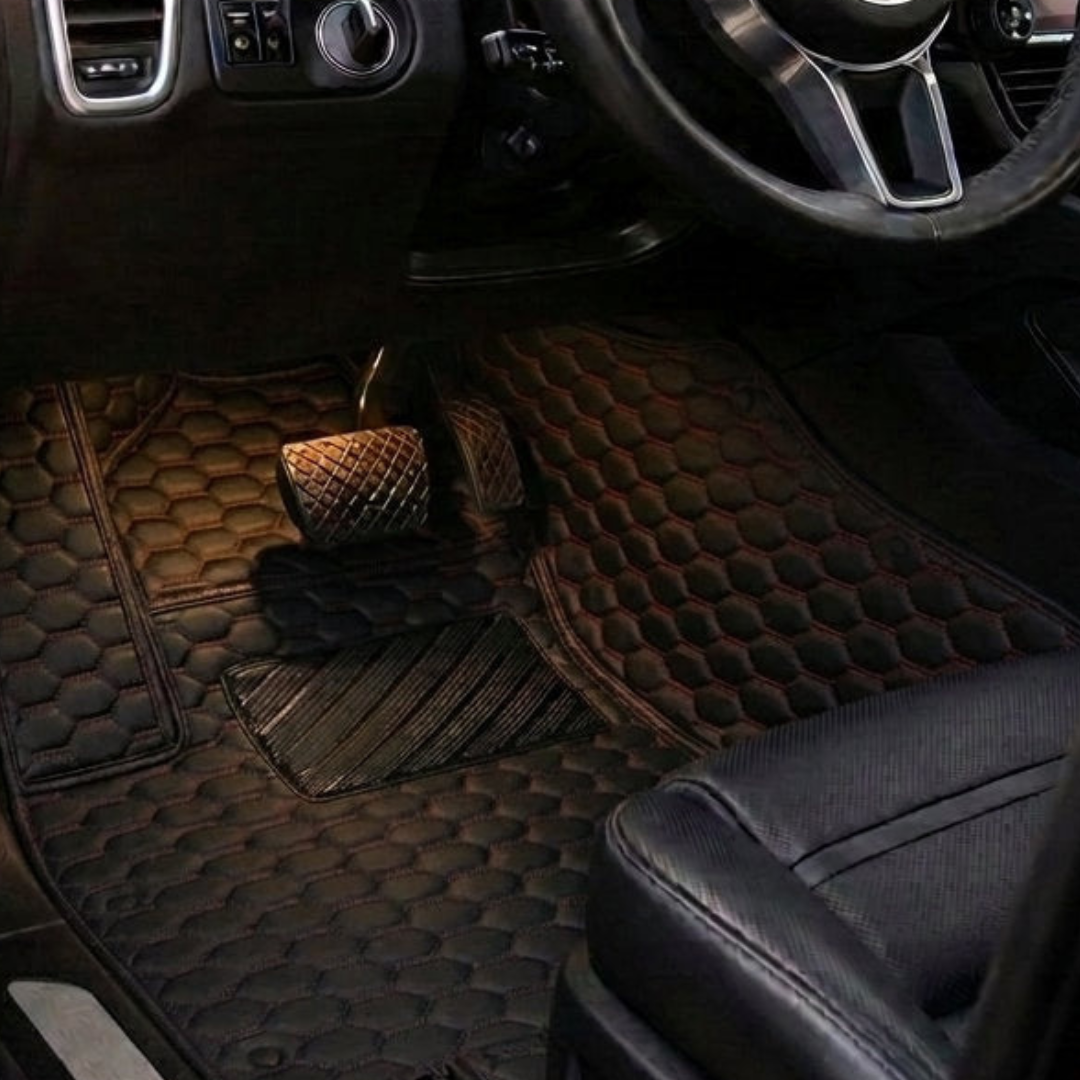 Matrikar Hexa Series custom fit car mat in Black with red stitching, installed in a driver footwell