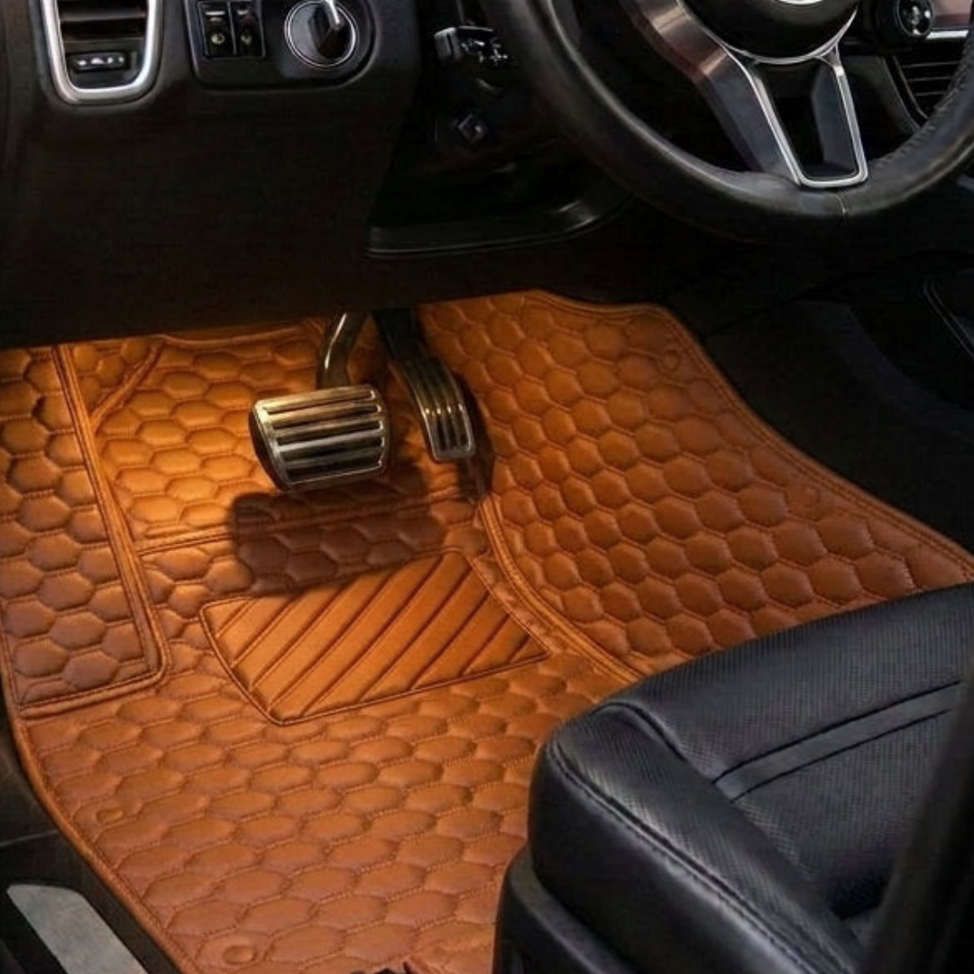 Matrikar Hexa Series custom fit car mat in Caramel Brown, installed in a driver footwell