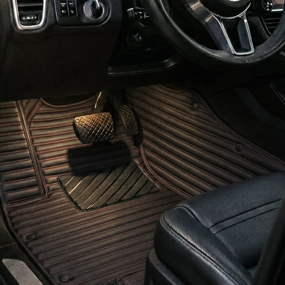 Matrikar Ribbed Series custom fit car mat in Black & Red, installed in a driver footwell