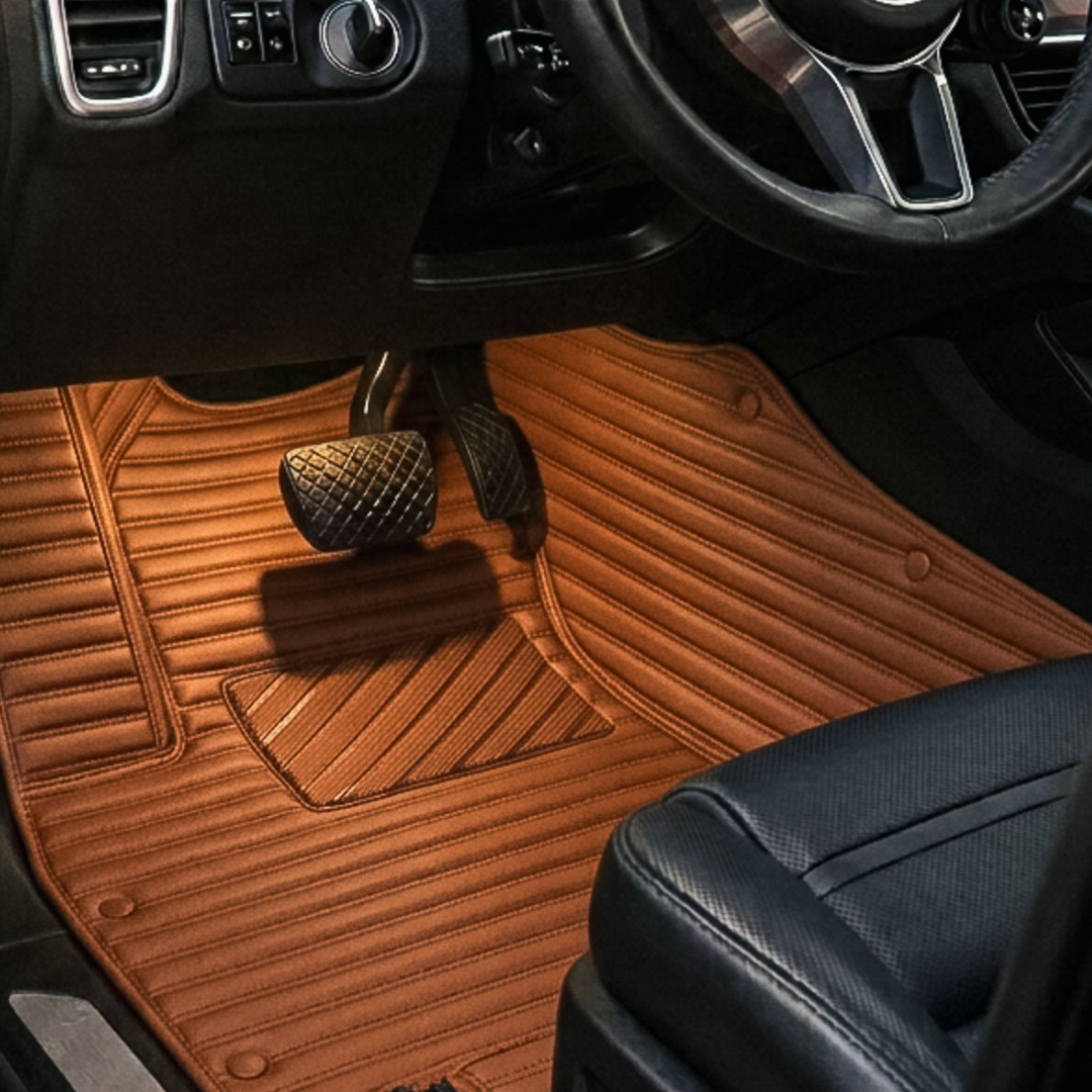 Matrikar Ribbed Series custom fit car mat in Caramel Brown, installed in a driver footwell