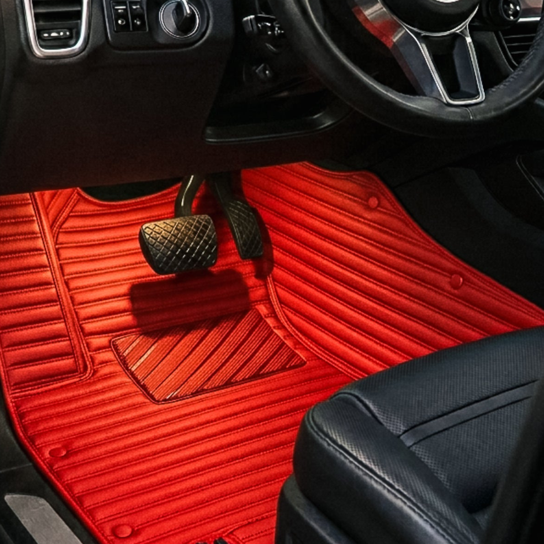 Matrikar Ribbed Series custom fit car mat in Ferrari Red, installed in a driver footwell